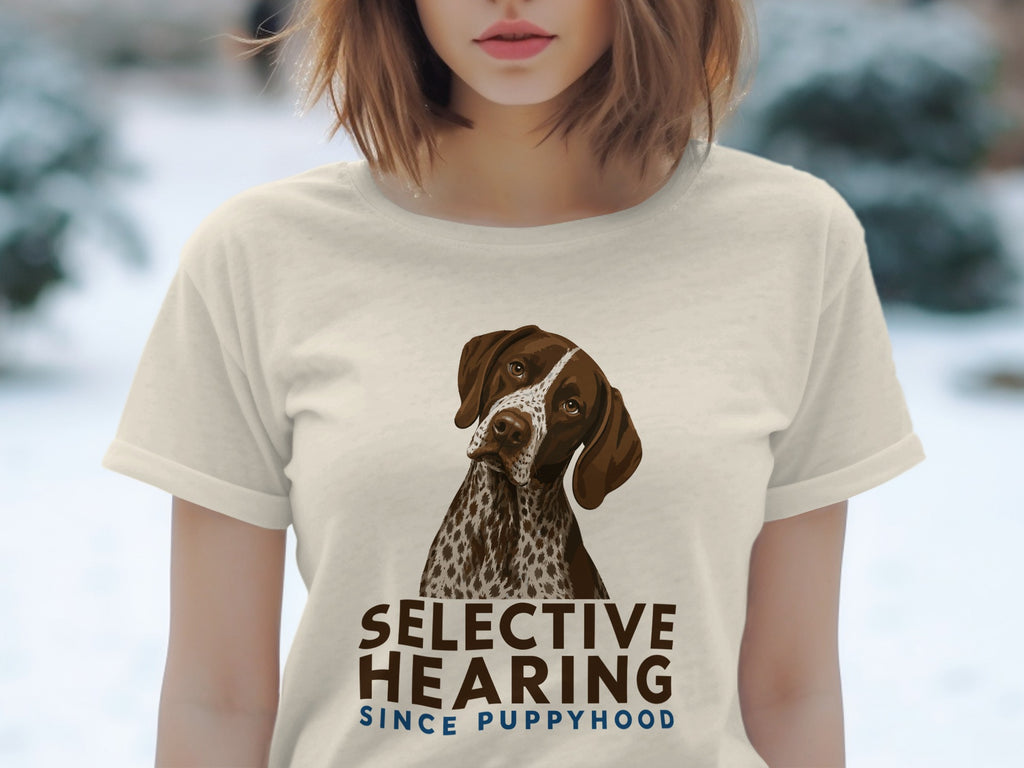Cream t-shirt with a German Shorthaired Pointer illustration and "Selective Hearing Since Puppyhood" text.