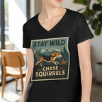 Black t-shirt with a graphic of a beagle chasing a squirrel, text "STAY WILD CHASE SQUIRRELS".