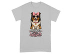 A dog wearing sunglasses and a bow on a t-shirt saying "First of all I'm a delight".