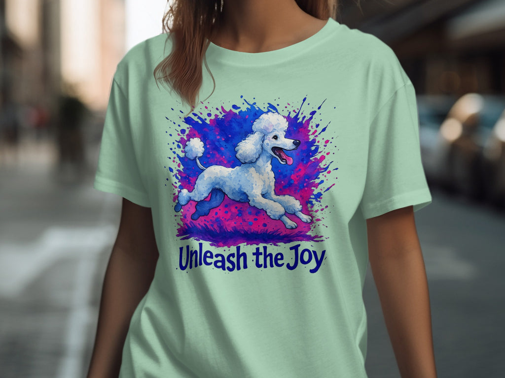 Light mint t-shirt with a joyful white poodle art and text "Unleash the Joy".