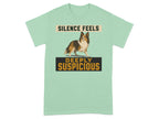 Light green t-shirt with dog and "SILENCE FEELS DEEPLY SUSPICIOUS" text.