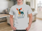 White t-shirt with stylized dog graphic and text "feral little creature, perfectly formed".