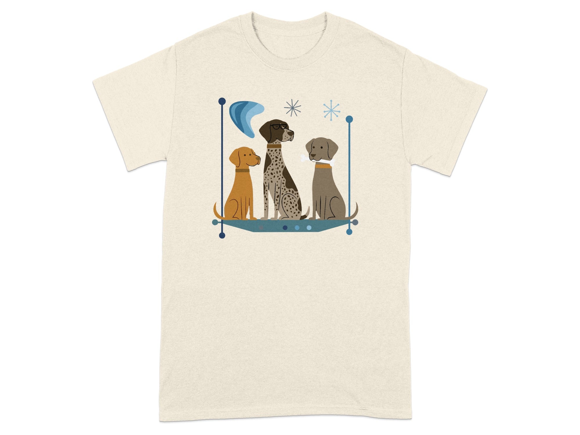 Three stylized dogs in mid-century modern illustration on a cream t-shirt.