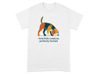 White t-shirt with graphic of colorful dog sniffing ground and text "feral little creature, perfectly formed".