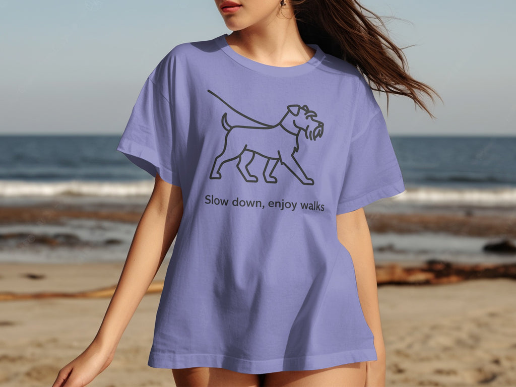 Purple t-shirt with line art dog and text "Slow down, enjoy walks".