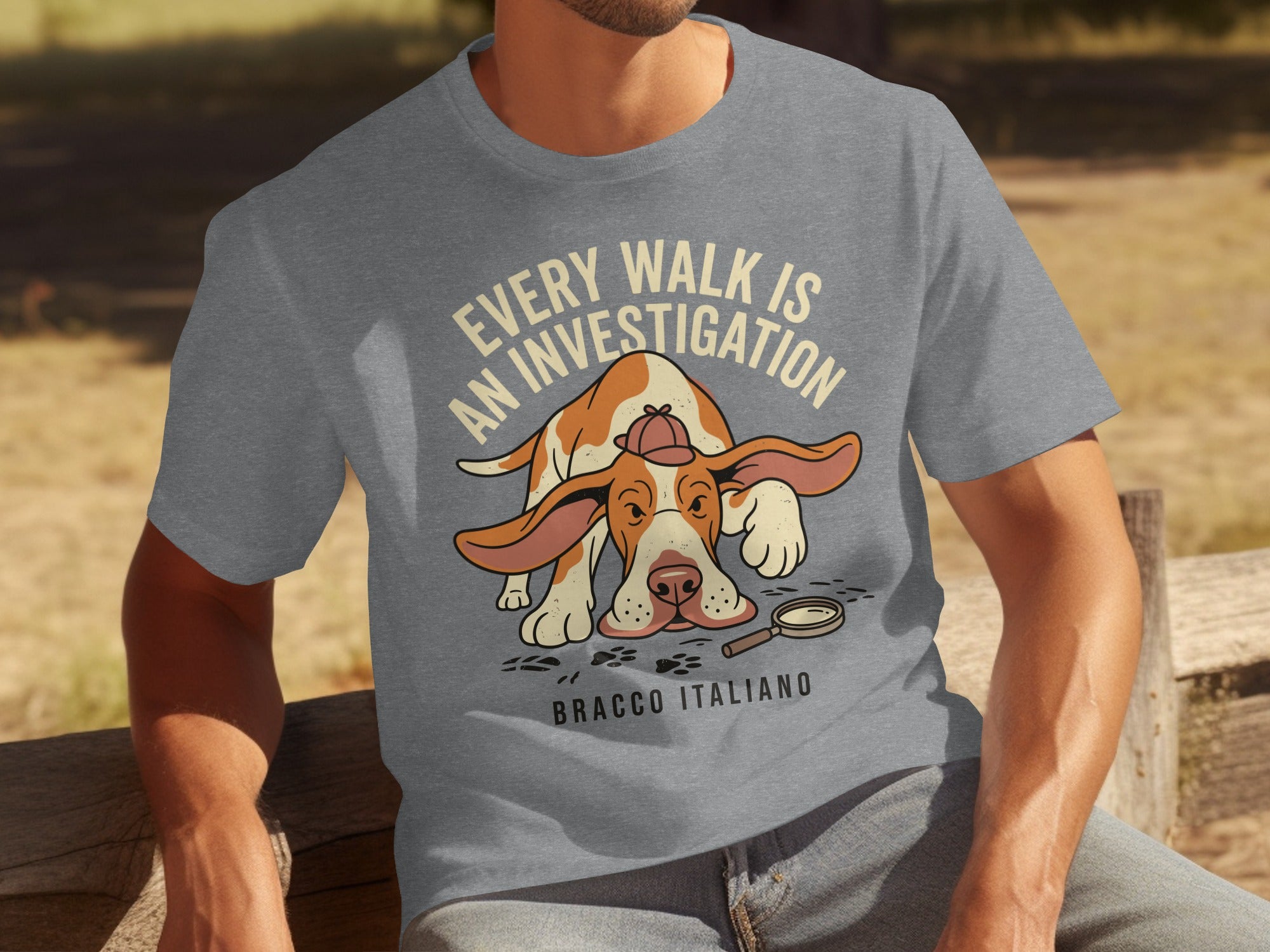 Grey t-shirt with Bracco Italiano dog wearing a detective hat, text "Every walk is an investigation".