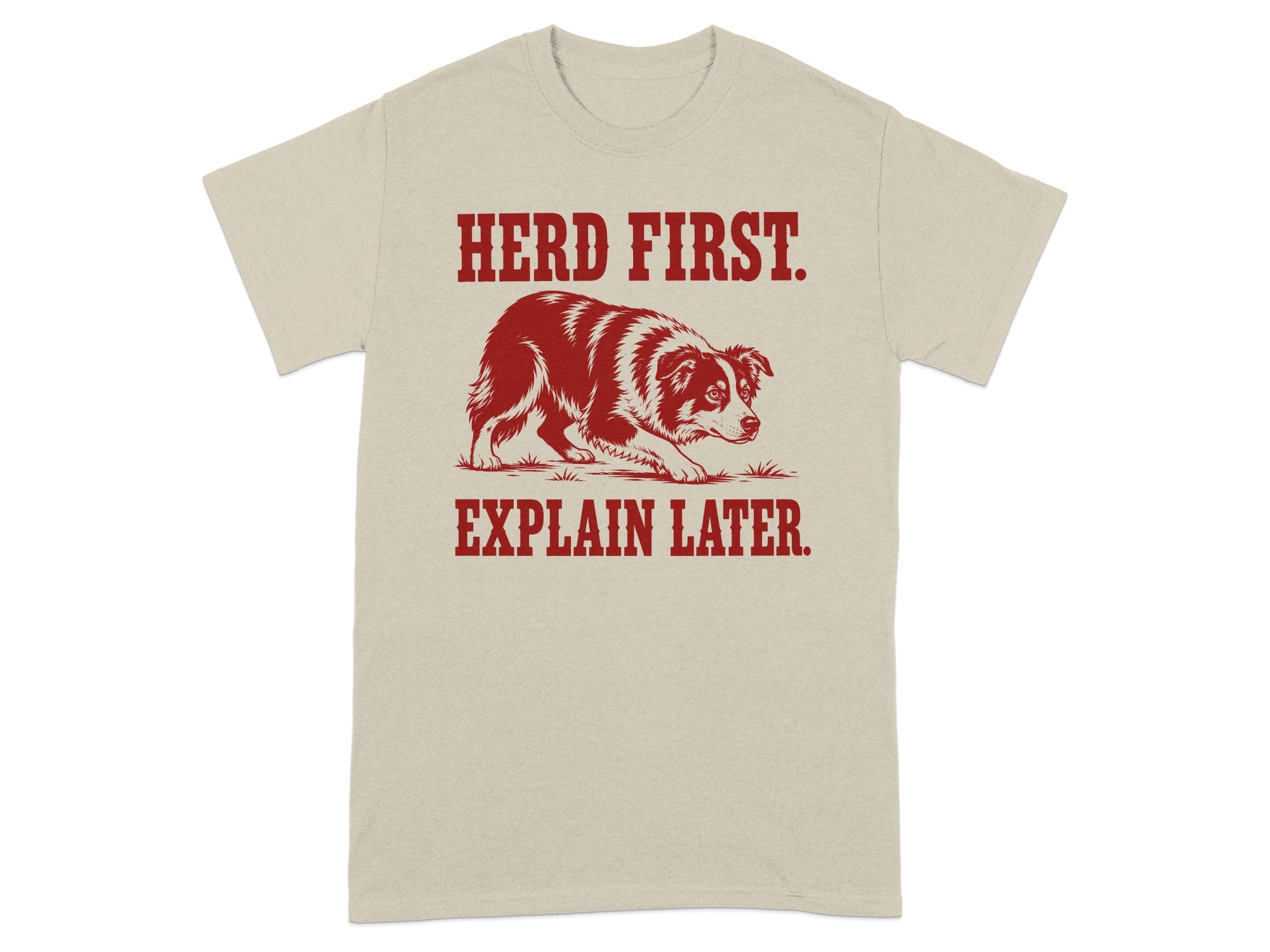 Beige t-shirt with dog and "Herd First. Explain Later." text.