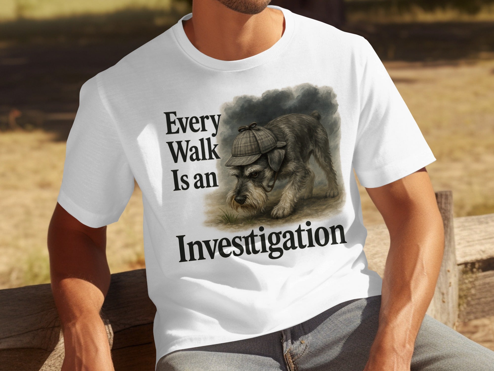 A schnauzer wearing a detective hat on a white t-shirt with "Every Walk Is an Investigation"