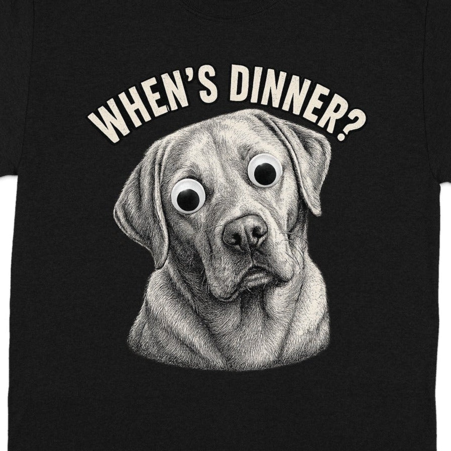 Black t-shirt with a cartoon dog wearing googly eyes and the text "When's Dinner?".