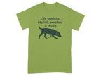 Green t-shirt with silhouette of a dog and text: "Life update: My lab smelled a thing"
