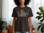 Brown t-shirt with dog and "EAT. SLEEP. ZOOMIES. REPEAT." text.