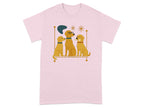 Three golden dogs sit on a shelf with a bone and abstract art.