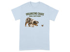 Light blue t-shirt with a dog and butterfly graphic, "ORGANIZING CHAOS" text.