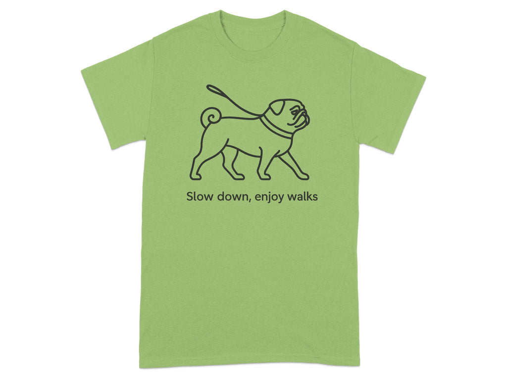 Green t-shirt with a black outline drawing of a pug on a leash and the text "Slow down, enjoy walks".