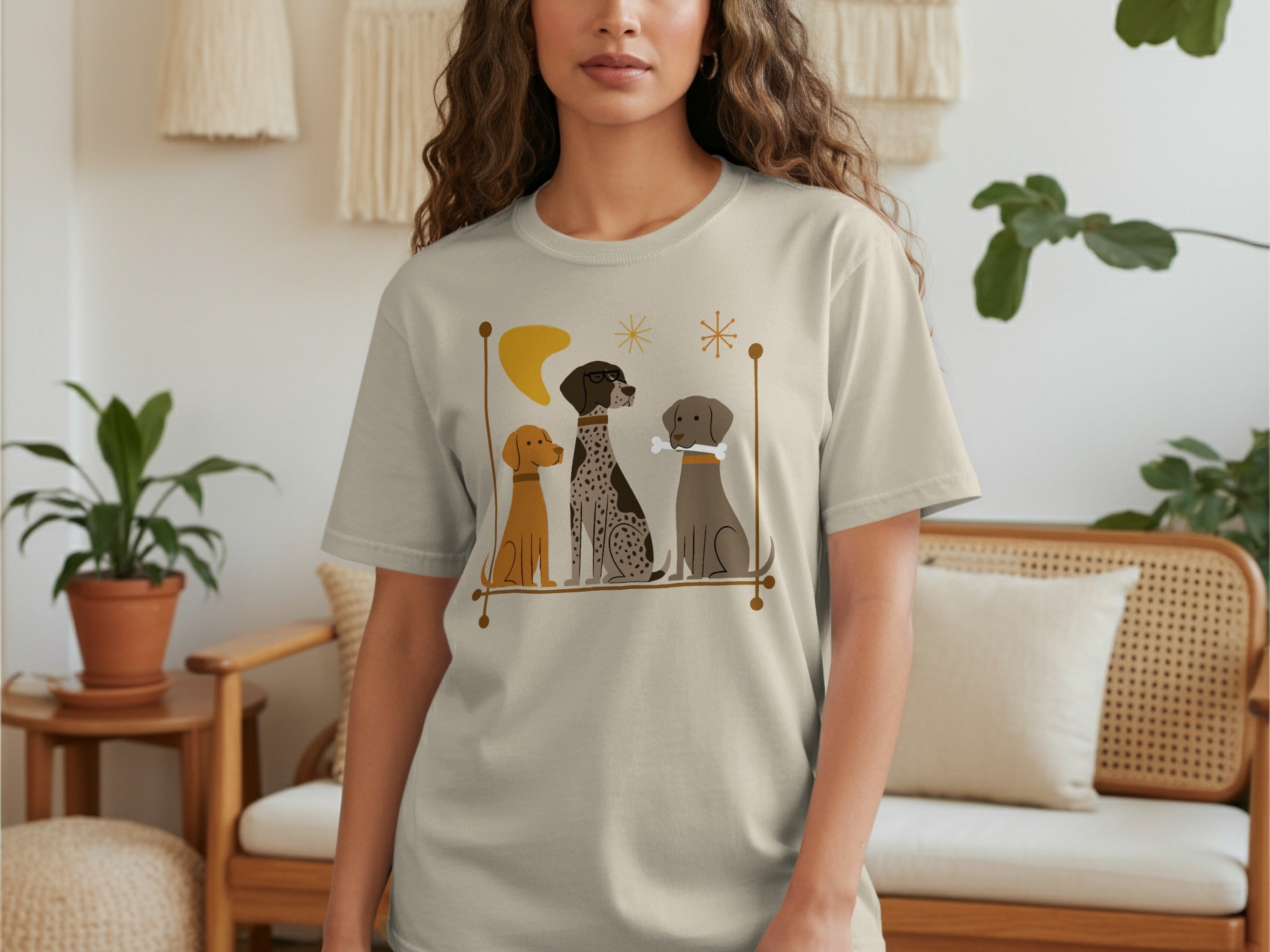 T-shirt with three dog illustrations, a bone, and a crescent moon.