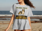 Light grey t-shirt with a dog and text "SILENCE FEELS DEEPLY SUSPICIOUS".