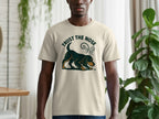 Cream t-shirt with dark green dog graphic and "TRUST THE NOSE" text.