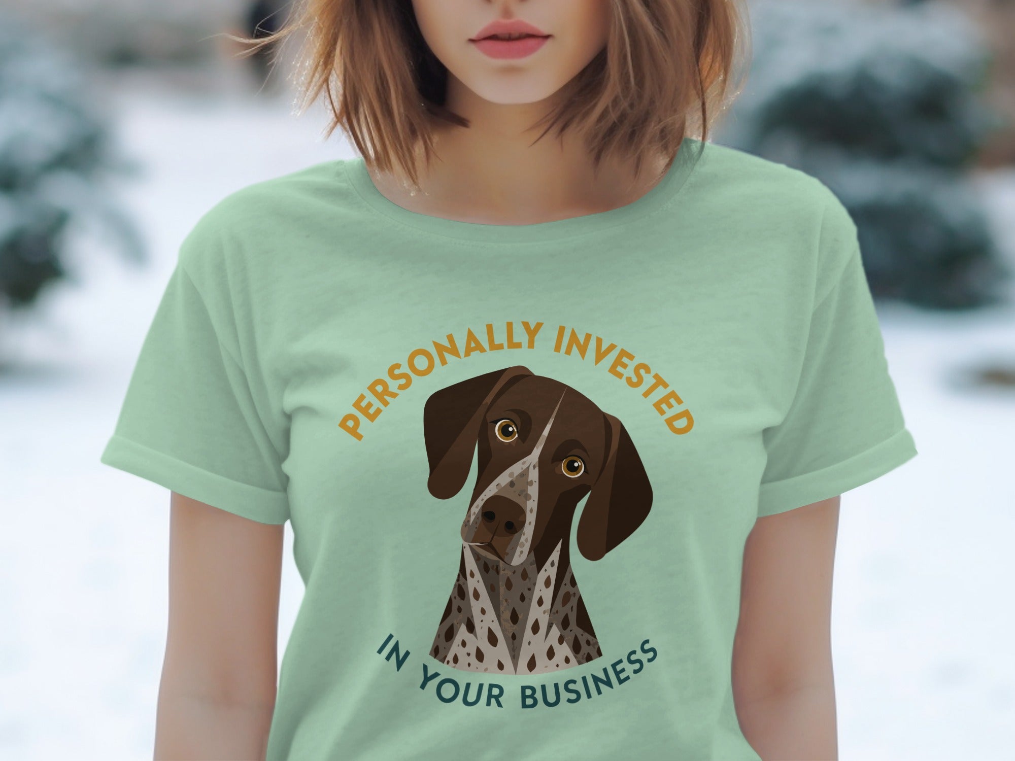 Light green t-shirt with German Shorthaired Pointer and text "PERSONALLY INVESTED IN YOUR BUSINESS".