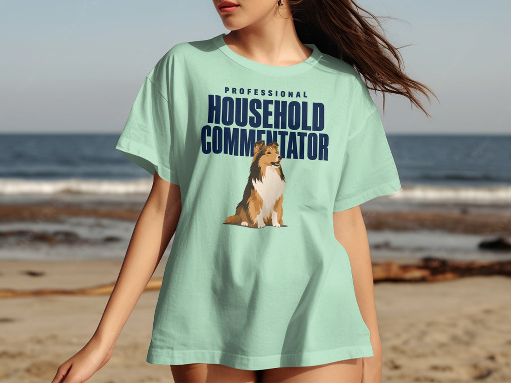 Light blue t-shirt with "PROFESSIONAL HOUSEHOLD COMMENTATOR" and a dog graphic.