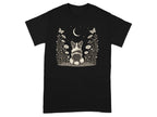 Black t-shirt with a corgi sitting in a field of flowers under a crescent moon.