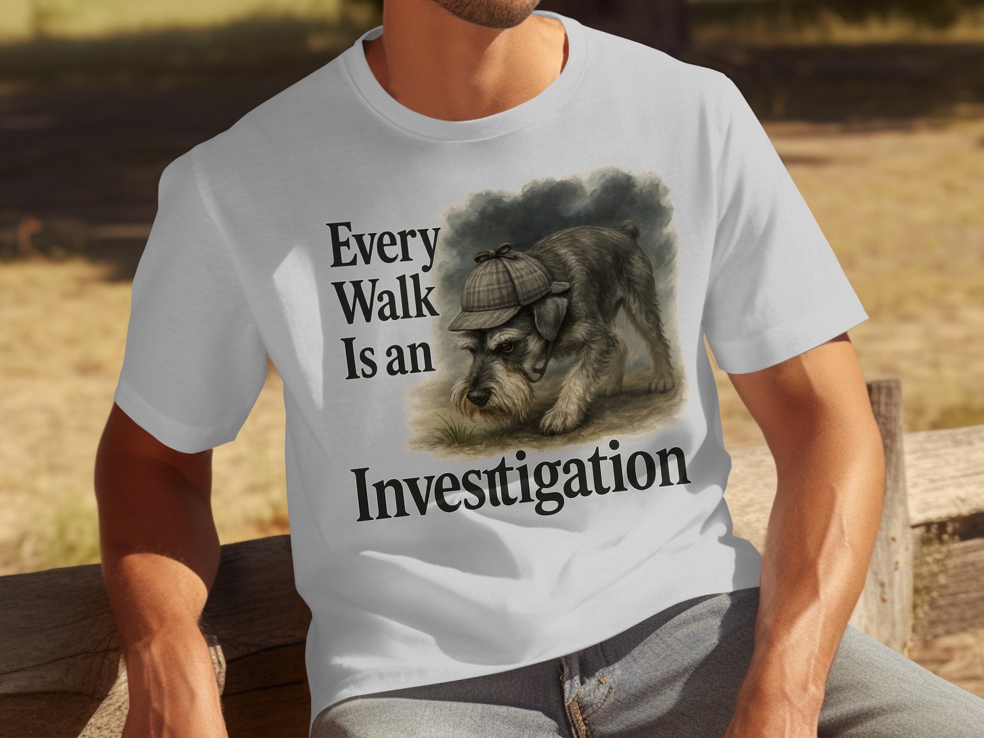 White t-shirt with text "Every Walk Is an Investigation" and a schnauzer wearing a deerstalker hat.