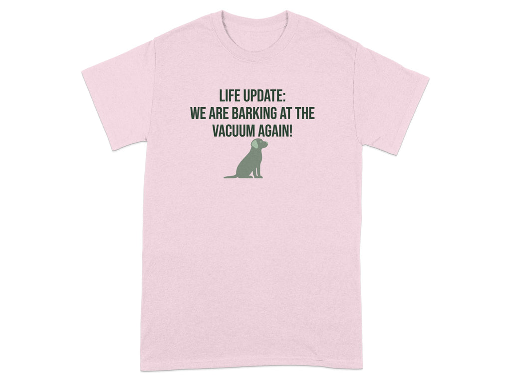 Pink t-shirt with a dog silhouette and text "LIFE UPDATE: WE ARE BARKING AT THE VACUUM AGAIN!".