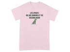 Pink t-shirt with a dog silhouette and text "LIFE UPDATE: WE ARE BARKING AT THE VACUUM AGAIN!".