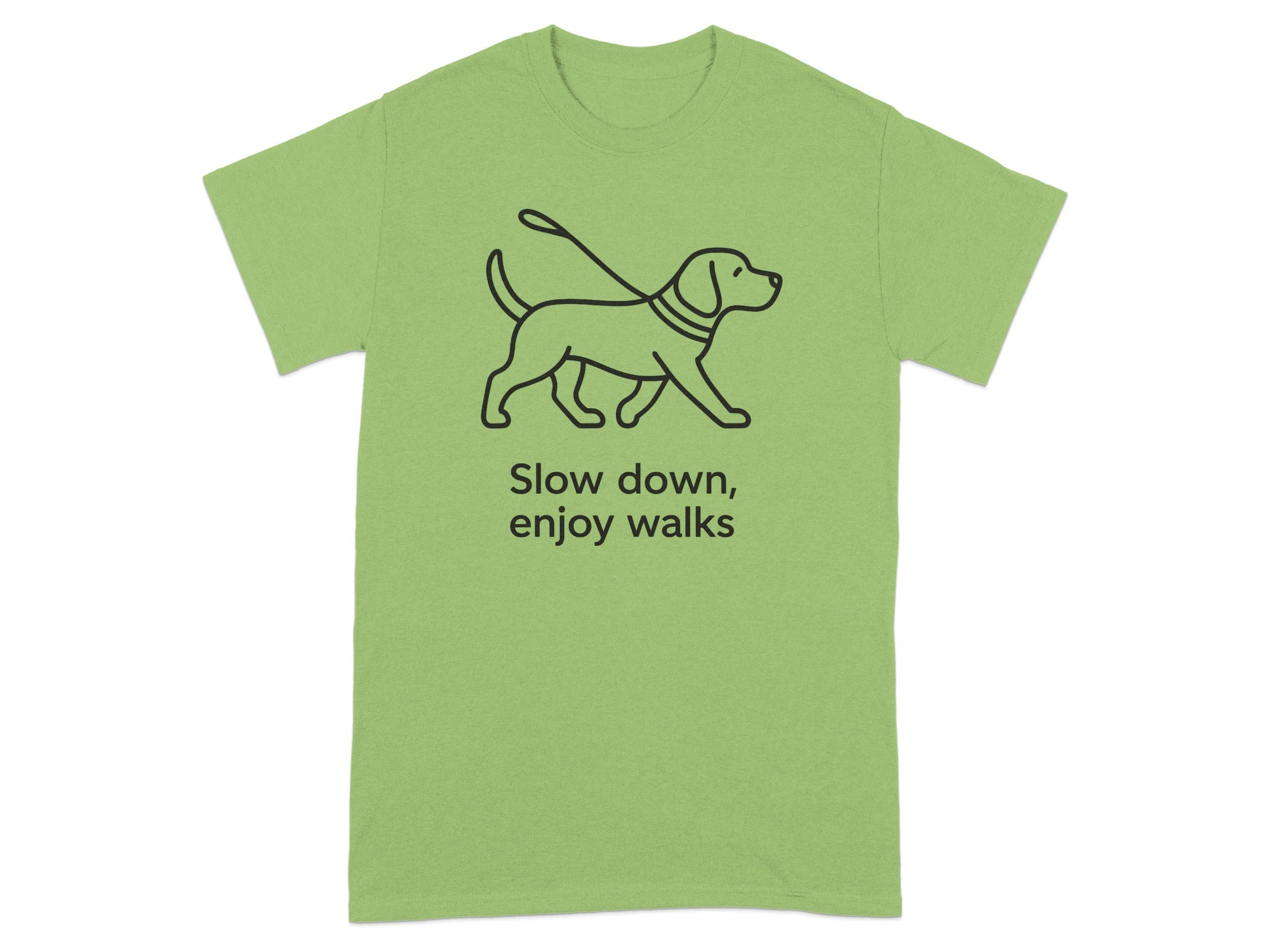 Green t-shirt with black line drawing of a dog on a leash and text "Slow down, enjoy walks".