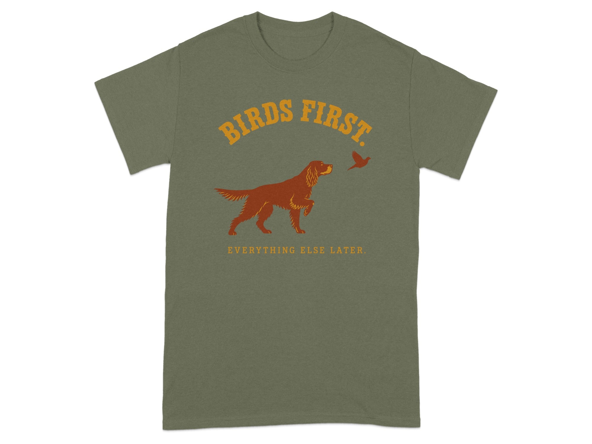 Green t-shirt with "BIRDS FIRST. EVERYTHING ELSE LATER." text and dog pointing at bird.