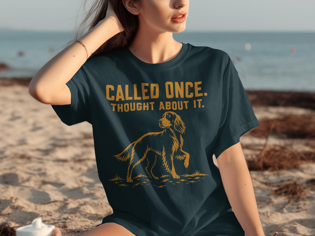 Dark blue t-shirt with dog graphic and "CALLED ONCE. THOUGHT ABOUT IT." text.