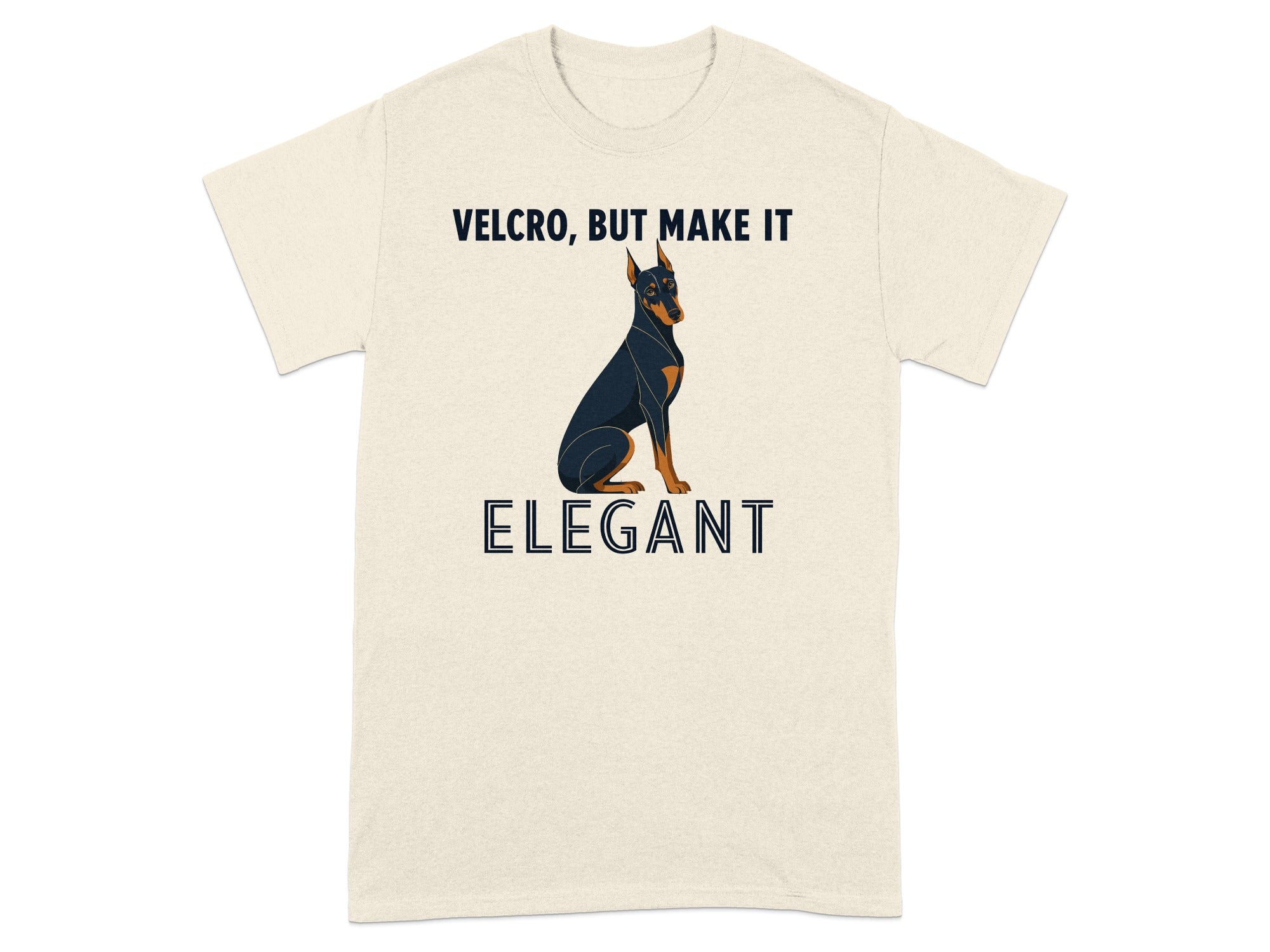Cream t-shirt with black Doberman and text "VELCRO, BUT MAKE IT ELEGANT".