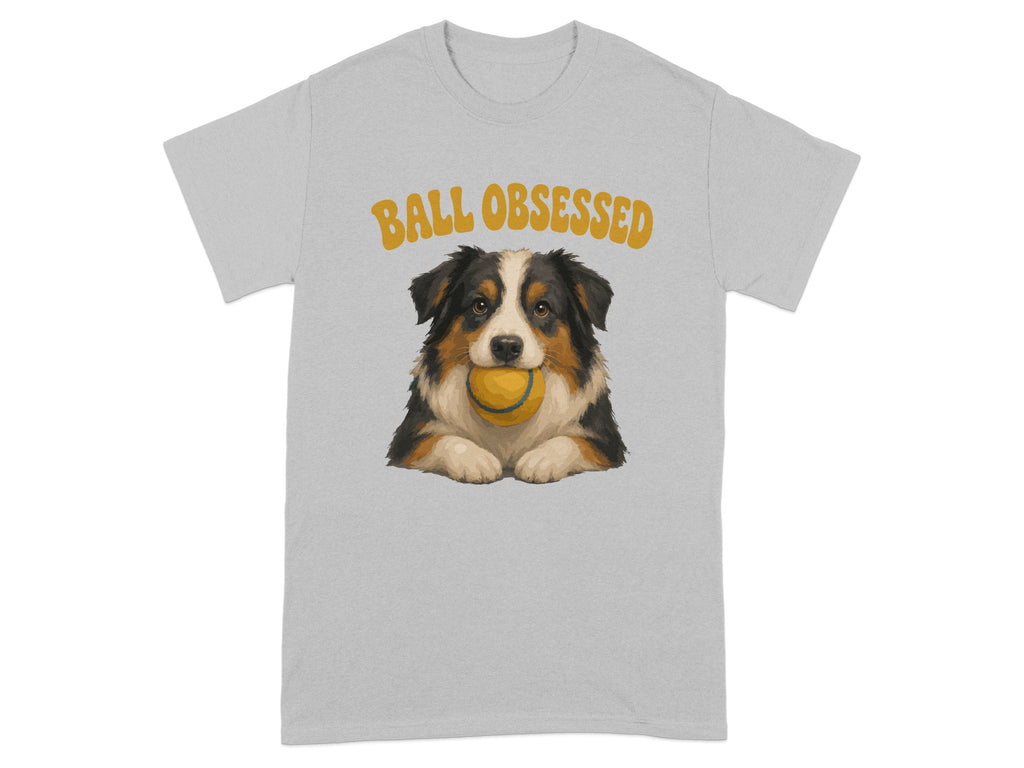 Grey t-shirt with a painted Australian Shepherd holding a yellow tennis ball in its mouth.