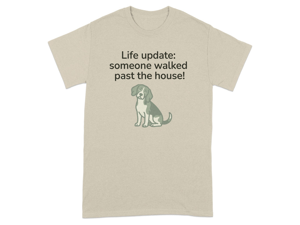 Beige t-shirt with a dog graphic and "Life update: someone walked past the house!"