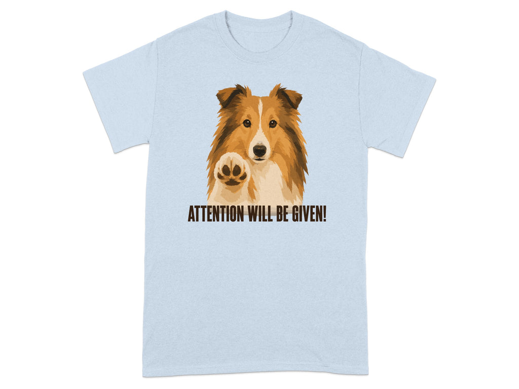 Light blue t-shirt with a Sheltie dog pawing with the text "ATTENTION WILL BE GIVEN!".