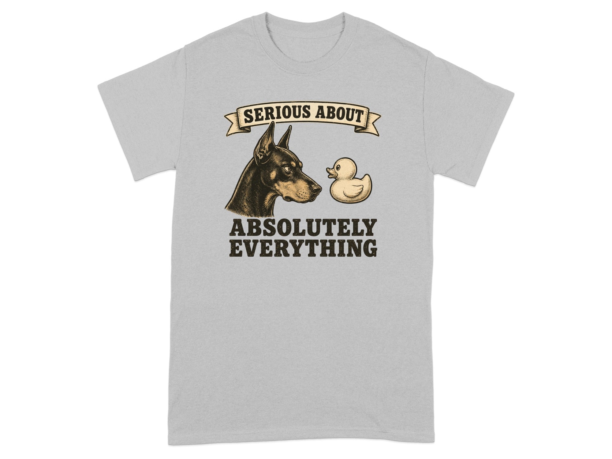 Doberman pinscher looking at a rubber duck with text "SERIOUS ABOUT ABSOLUTELY EVERYTHING".