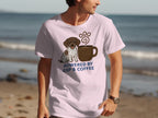 Pink t-shirt with German Shorthaired Pointer and coffee cup graphic.