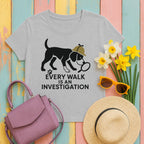 mig2 every-walk-is-an-investigation-beagle-ar tee flat lay hero v8