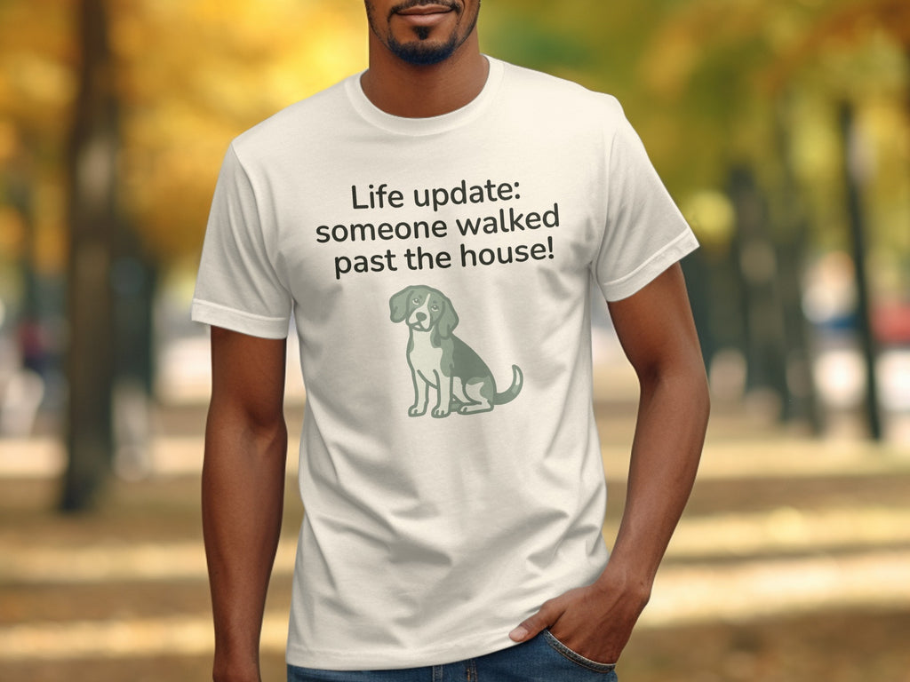 White t-shirt with text "Life update: someone walked past the house!" and dog graphic.