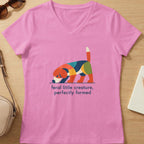 Pink v-neck t-shirt with abstract dog graphic and text.