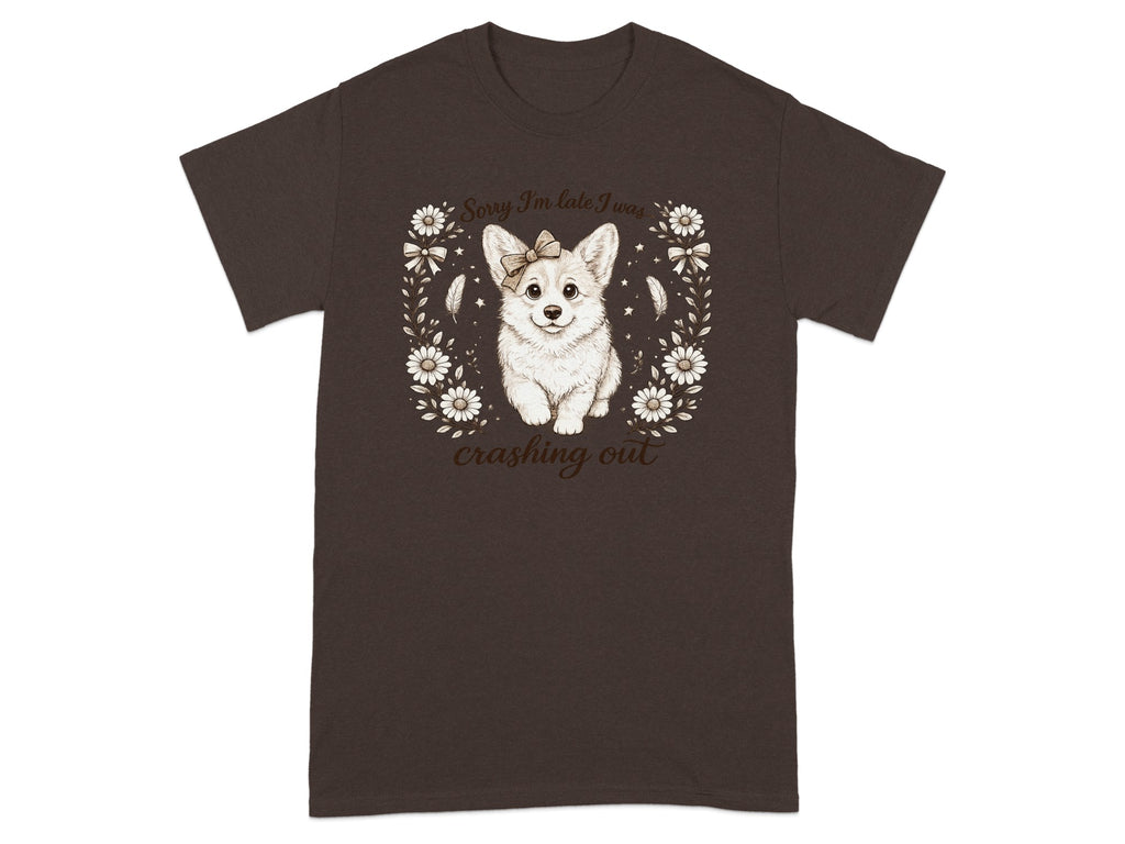Brown t-shirt with a cute corgi wearing a bow, surrounded by flowers and text.