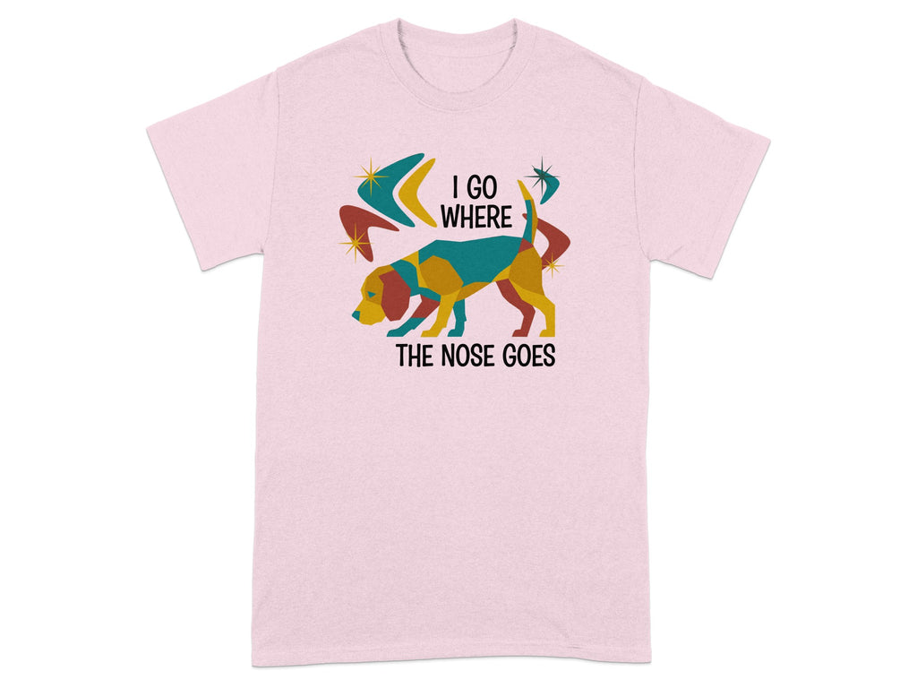 Pink t-shirt with colorful dog and text "I GO WHERE THE NOSE GOES".