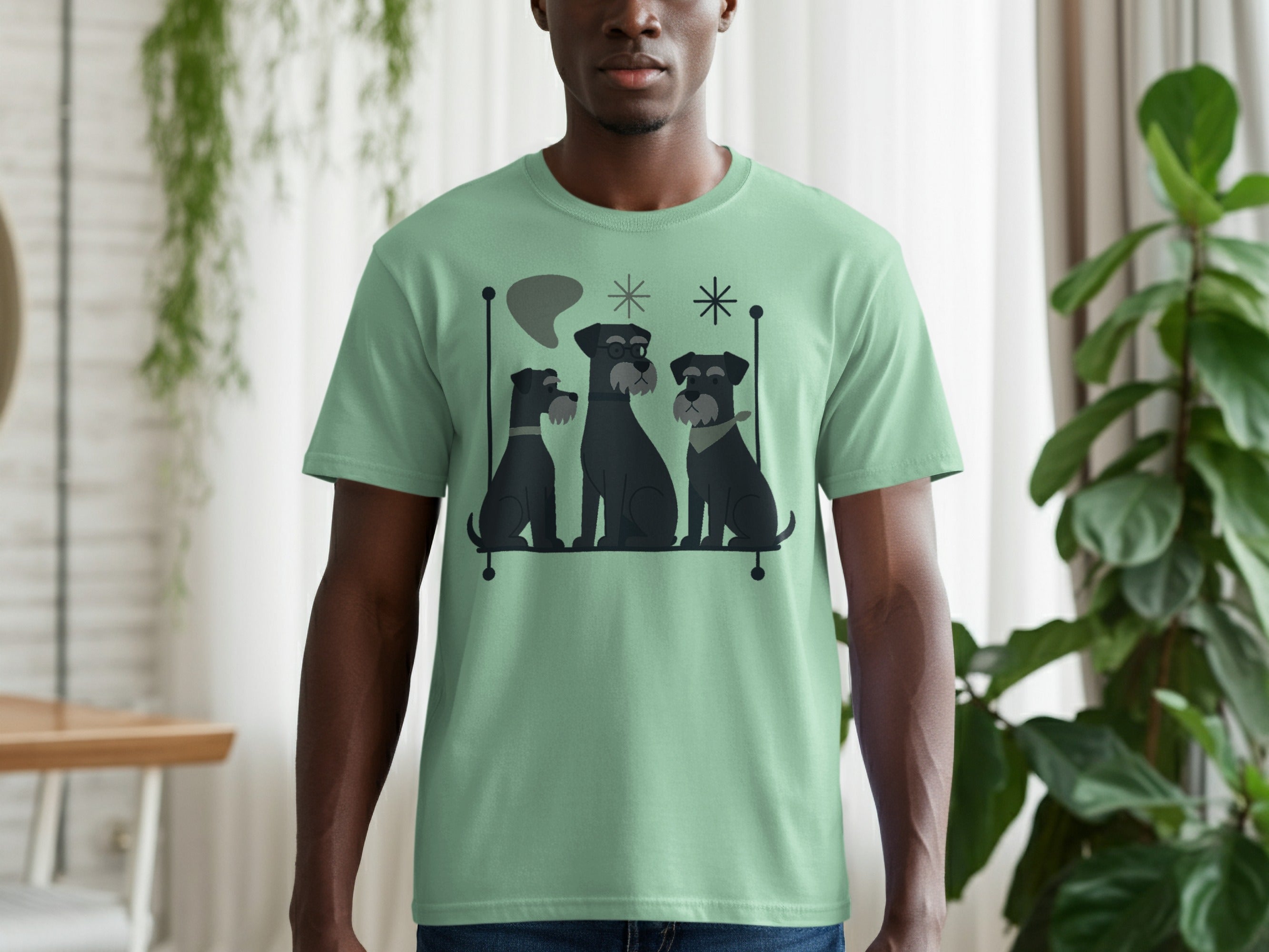Mint green t-shirt with a graphic of three black schnauzers with mid-century modern style.
