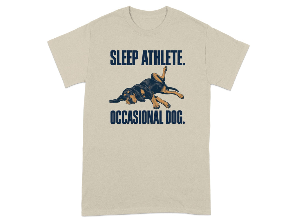 T-shirt with a Rottweiler sleeping and text "SLEEP ATHLETE. OCCASIONAL DOG."