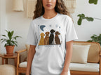 White t-shirt with four cartoon dogs sitting in a line.