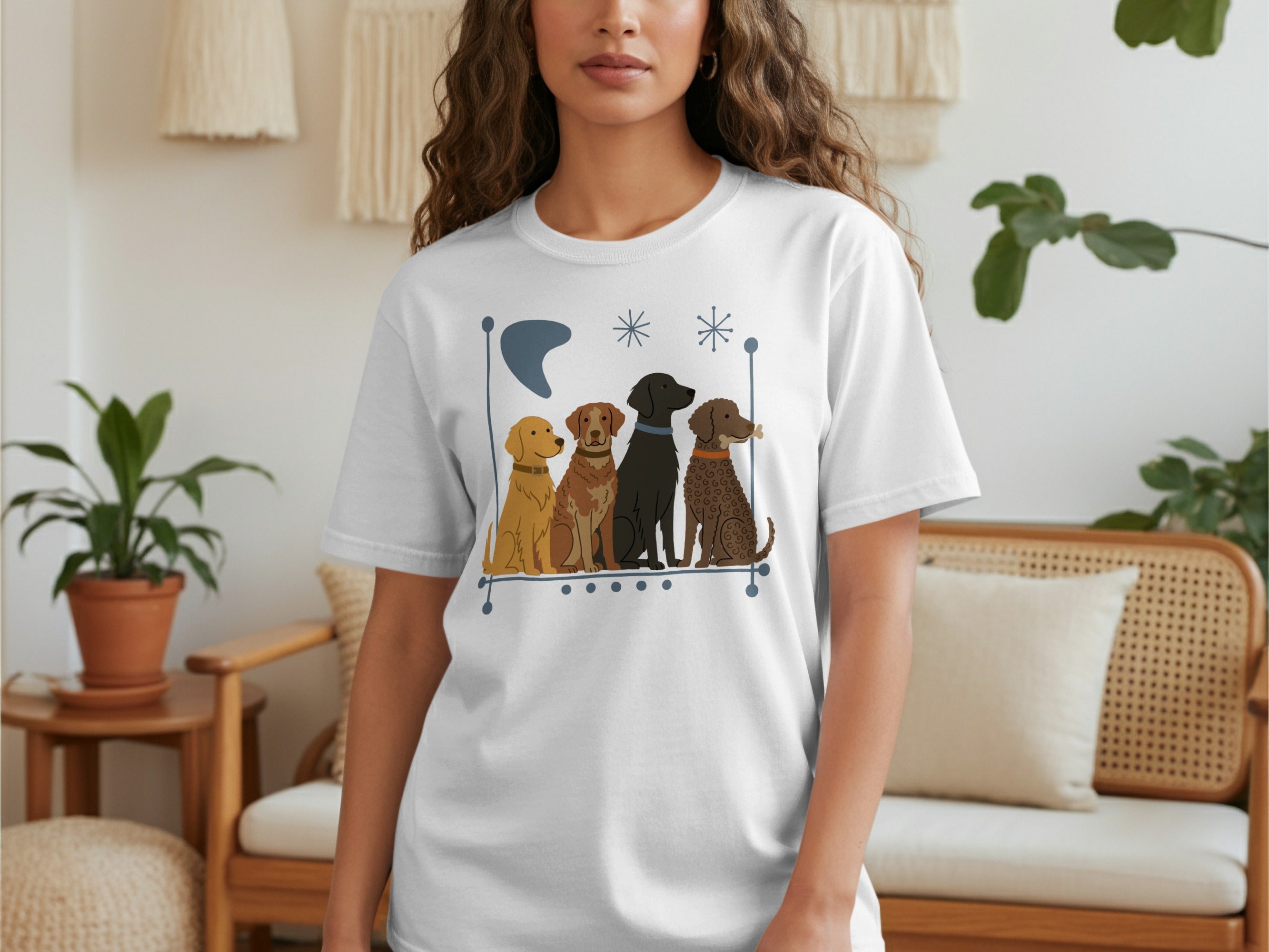 White t-shirt with four cartoon dogs sitting in a line.