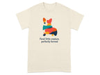 Cream t-shirt with colorful abstract corgi and text "feral little creature, perfectly formed".