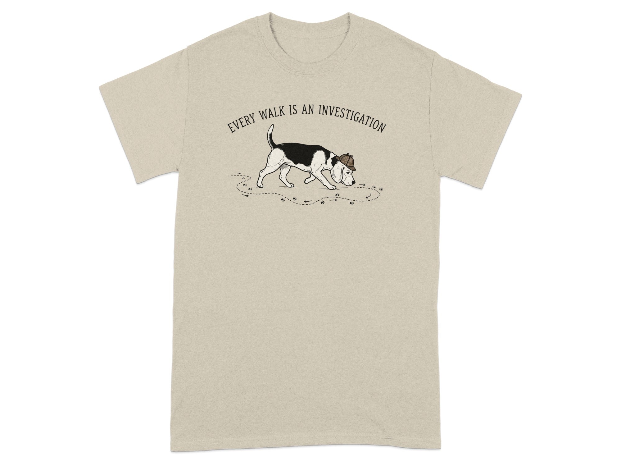 Beagle wearing detective hat on tan t-shirt, with paw prints.