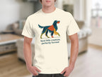 Cream t-shirt with abstract colorful dog and text: feral little creature, perfectly formed.