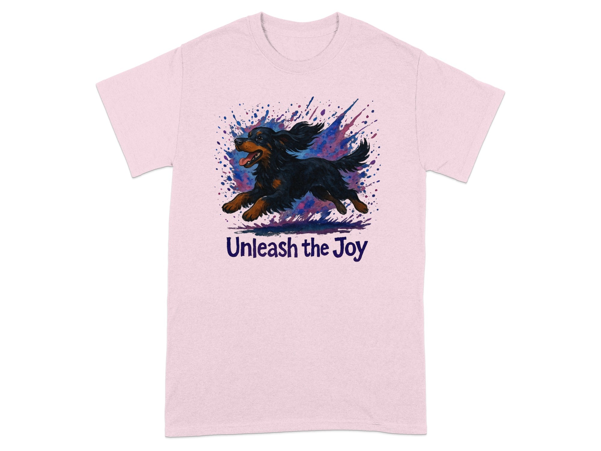 Pink t-shirt with a running black and tan dog and the text "Unleash the Joy".