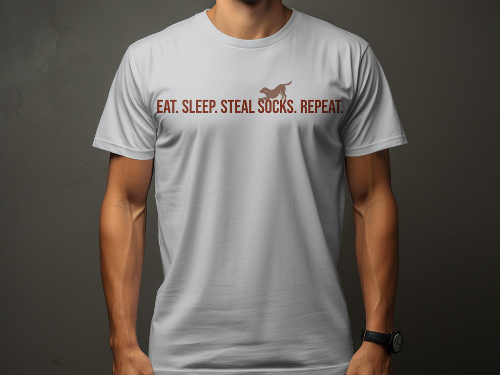 White t-shirt with "EAT. SLEEP. STEAL. SOCKS. REPEAT." and dog graphic.